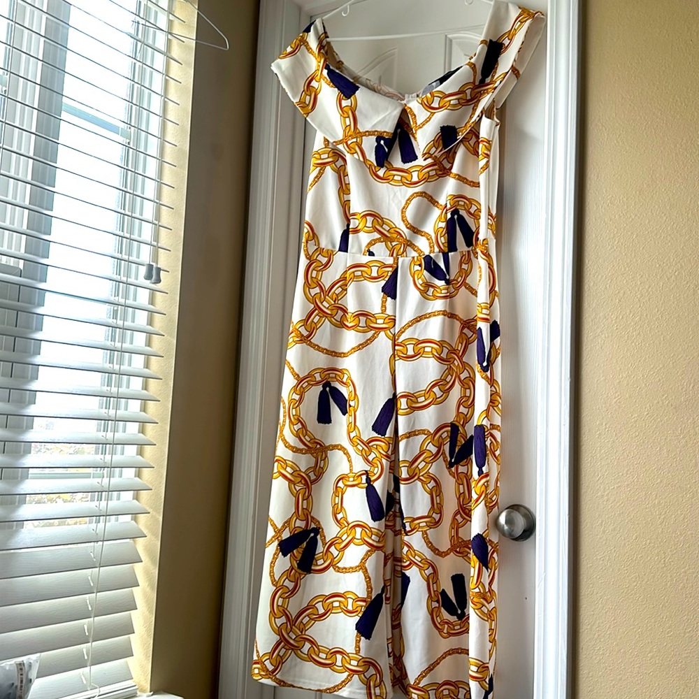Ashley Stewart color egg nog and purple jumpsuit details gold chain